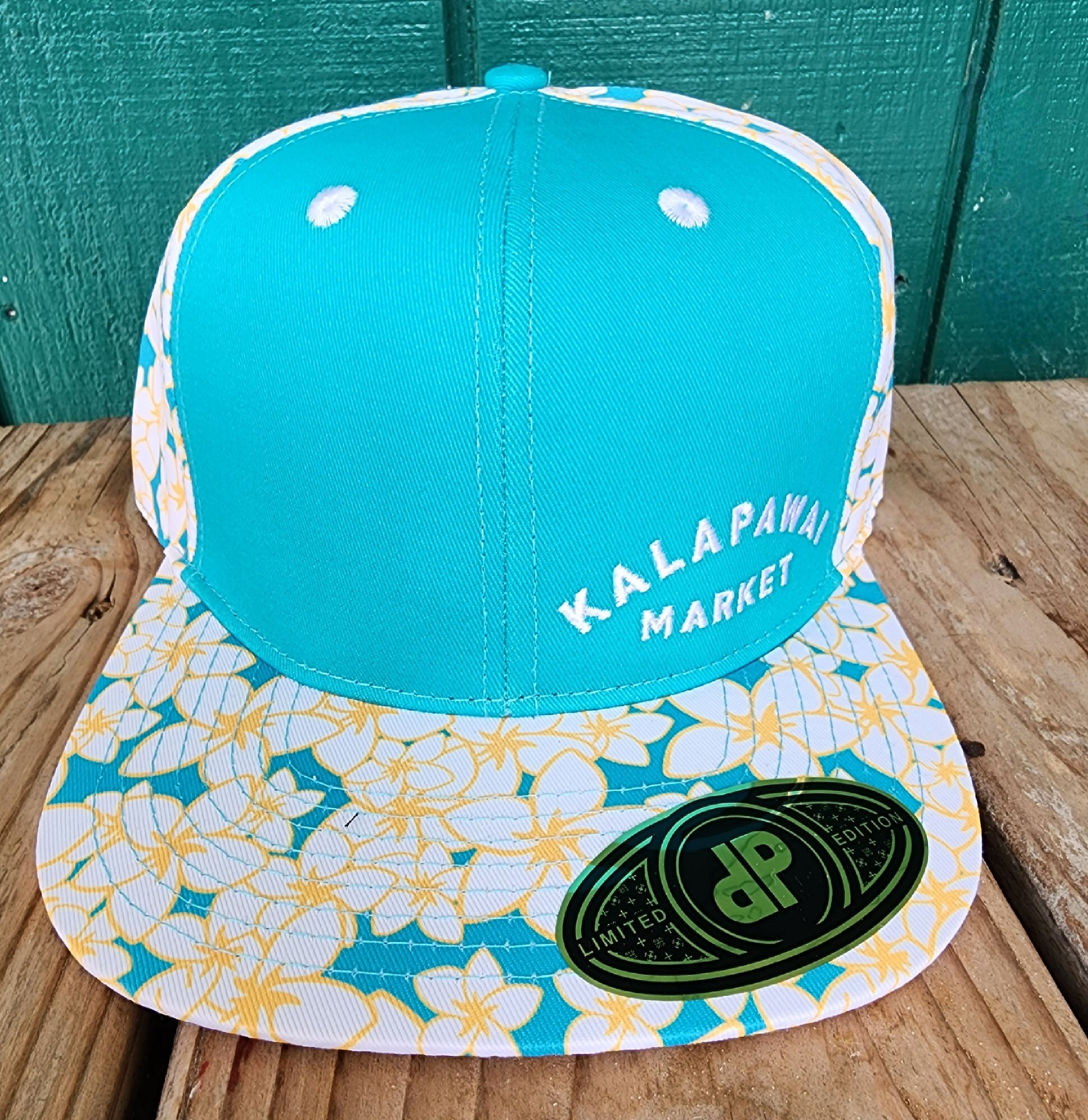 Double Portion snap back hats with Kalapawai stitched on the front.